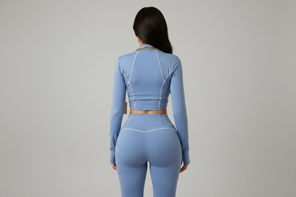 Serene blue buttery‑soft workout set with four‑way stretch and a breathable, curve‑enhancing fit. A luxury two‑piece activewear outfit designed for confident women.