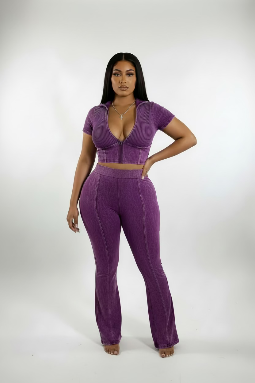 Purple jumpsuit on a mannequin against a white background
