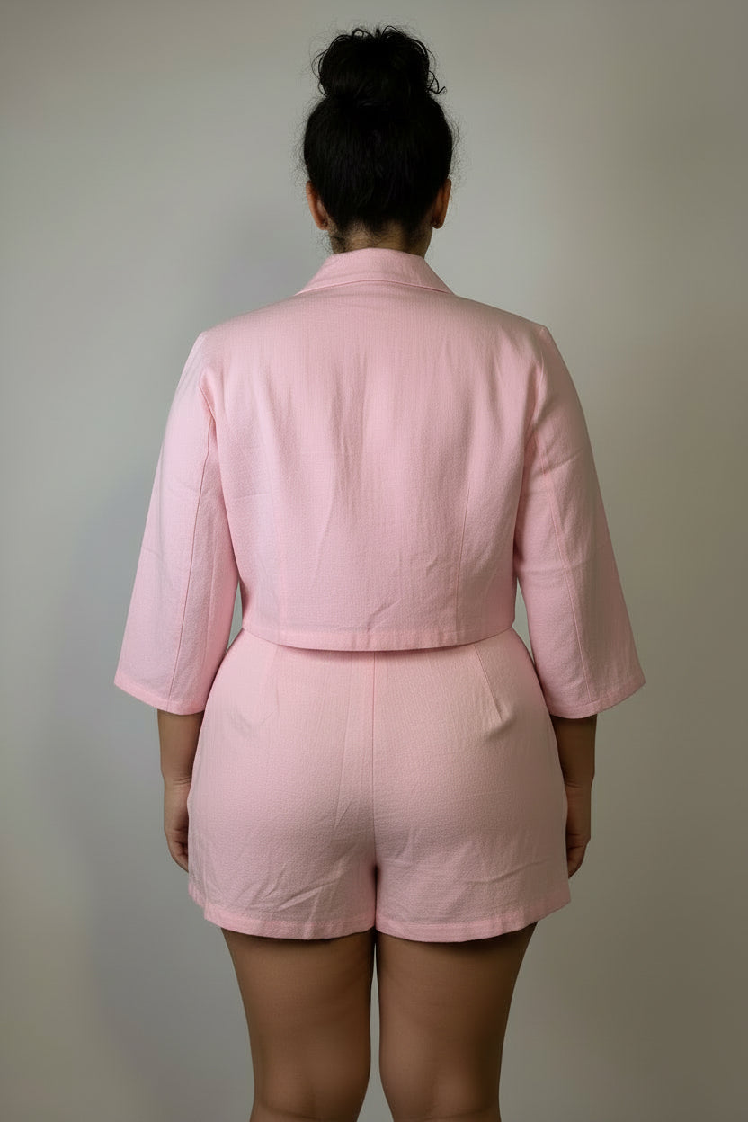 baby‑pink button‑up crop top and shorts set with pockets in a studio setting — Sophi Haus linen stretch streetwear.  